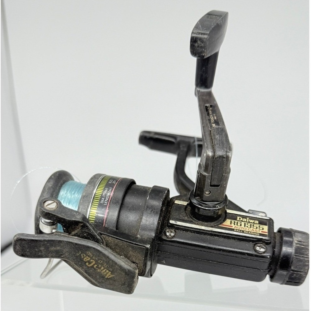 Vtg Daiwa RG 1355 Auto Cast Black Spinning Fishing Reel Made in Japan